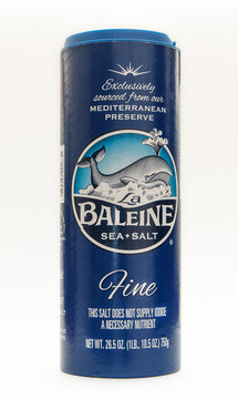 Bottle of Baleine sea salt isolated on white background.