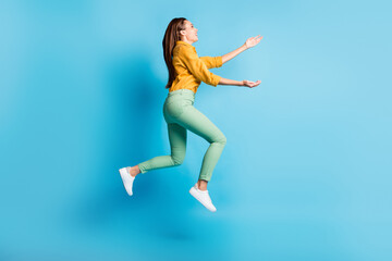 Fototapeta na wymiar Full size profile photo of cool nice brunette lady jump hug wear shirt trousers sneakers isolated on turquoise color background