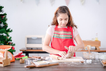 European girls prepare tools and ingredients for making gingerbread during Christmas and New Year celebrations