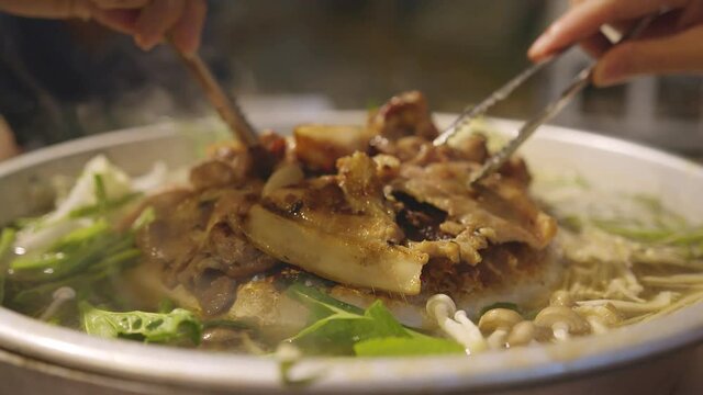 closeup famous asian street food bbg moo kata hot pot party enjoy eating dinner together with fun party and cheerful