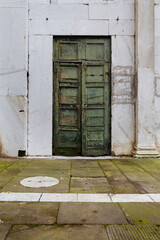 Lucca green church door