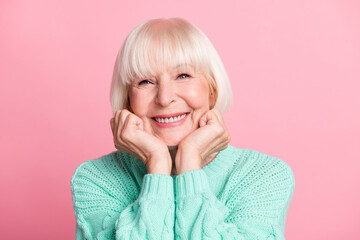 Photo portrait of charming senior woman in teal sweater blonde hair smiling touching cheeks...