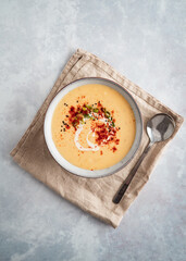 Parsnip cream soup on grey background food photography
