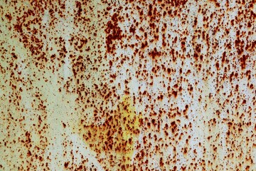 Background of metal sheet covered with white paint with numerous traces of corrosion