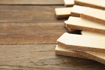 Sweet wafers on grey wooden background, top view.