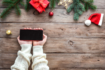 Christmas concept, smartphone in hands