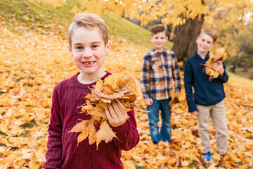 kids in autumn forest having great time together