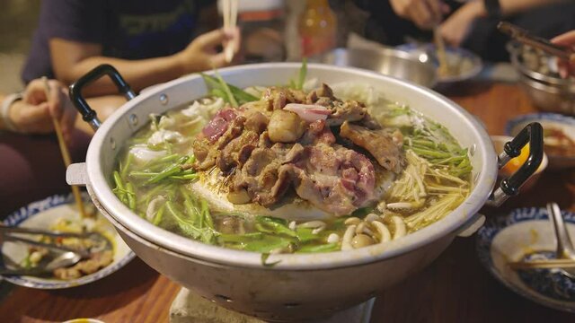 closeup famous asian street food bbg moo kata hot pot party enjoy eating dinner together with fun party and cheerful