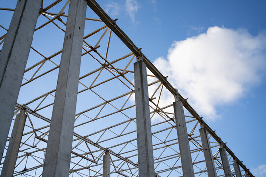 The structure is being built the frame of the house. against the sky