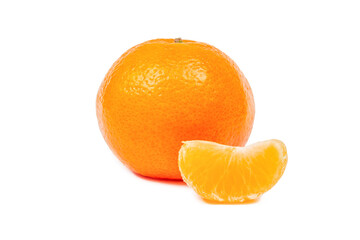 a ripe tangerine in the skin and a peeled Mandarin slice are isolated on a white background close-up