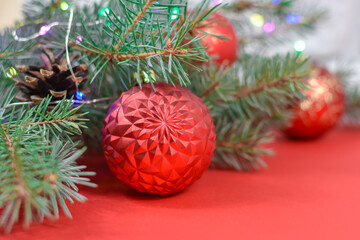 Red Christmas decorations on a red background. Merry Christmas card. Winter holiday theme. Happy New Year.