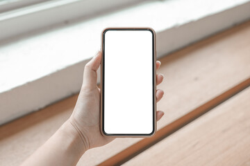 Women's hands holding cell telephone blank copy space screen. smart phone with technology concept