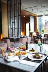 Luxury table settings for fine dining served and decorated table with food for guests in the restaurant