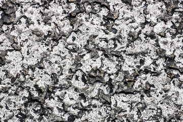 White paint asphalt texture. Grunge rough concrete background. Urban cracked wall. Closeup macro gravel pattern.