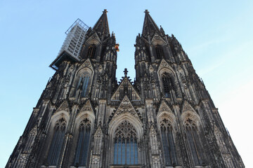 Fototapeta na wymiar The facade of Cologne Cathedral (Kolner Dom), Roman Catholic cathedral church. It is the largest Gothic church in northern Europe.