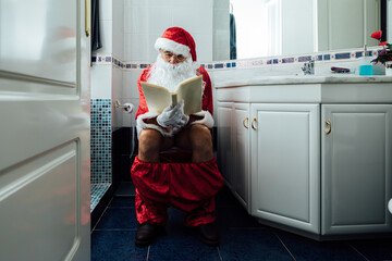 Santa Claus in the bathroom, sitting on the toilet pooping, reading a book