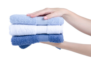 Stack folded towels in hand on white background isolation