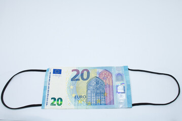 Coronavirus Face mask Euro banknotes with white background and Covid 19 money