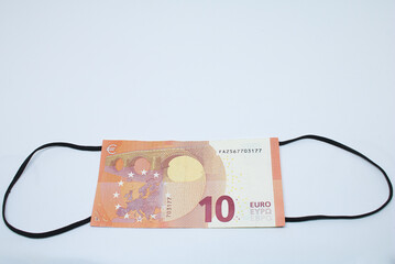 Coronavirus Face mask Euro banknotes with white background and Covid 19 money