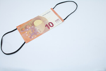 Coronavirus Face mask Euro banknotes with white background and Covid 19 money