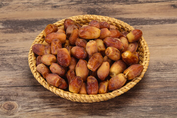 Sweet tasty dry dates in the basket