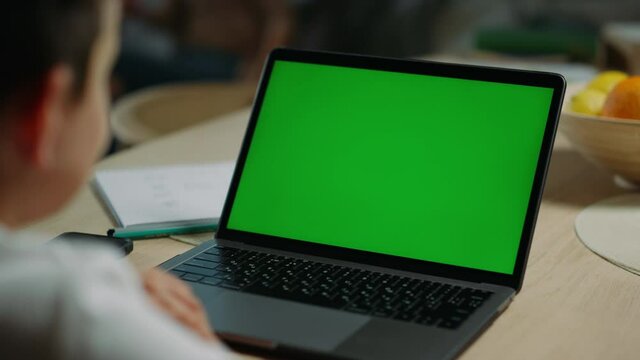 Unknown boy using mockup laptop online lesson. Schoolboy answering questions.