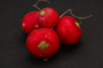 Ripe fresh radish heap over wooden
