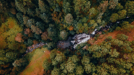 Aerial long exposure of a black stone waterfall, minimalist landscape made in central Mexico in one of its forests. 