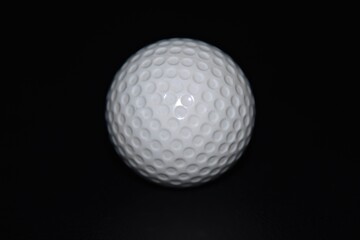 golf ball on black background