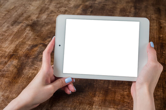 Mockup image: close up view of woman looking at modern digital tablet computer device with white blank screen. Mock up, copyspace, leisure time, template and technology concept