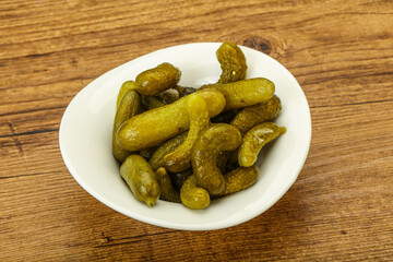 Pickled gherkin in the bowl