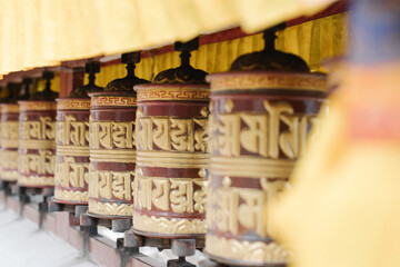 Buddhist prayer wheels in the temple