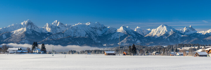 panoramic landscape at winter with alps mountains in Bavaria