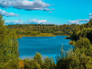 Beautiful view of forest lake Puzhanier in sunny summer day.