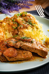 Stewed turkey meat with chorizo sausage.