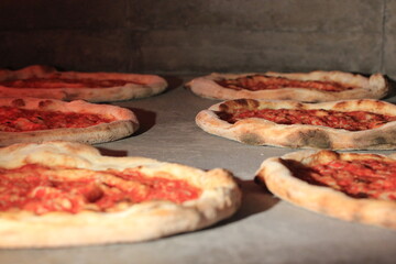 pizza base on the working electric oven