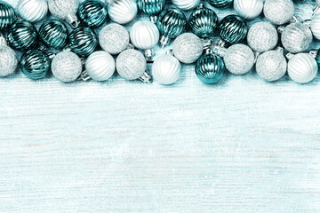 New Year Balls on blue wood background. Christmas background with colorful baubles. Happy New Year greeting card