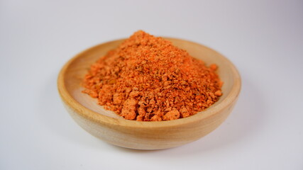 spicy chili powder in a wood bowl