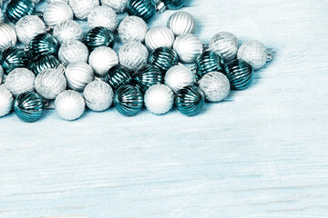 New Year Balls on blue wood background. Christmas background with colorful baubles. Happy New Year greeting card