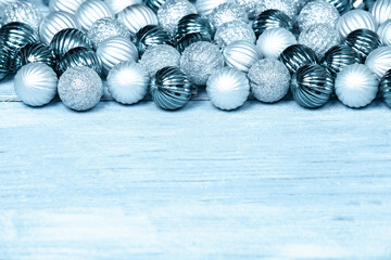New Year Balls on blue wood background. Christmas background with colorful baubles. Happy New Year greeting card