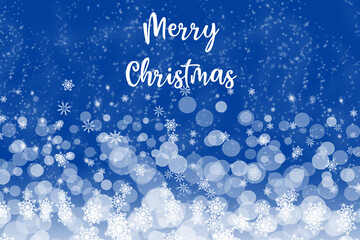Winter snowy blurry background in blue tones. Falling  abstract snowflakes in and inscription of Merry Christmas