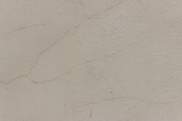 The surface of the wall, plastered in light brown.