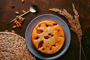 Delicious pear pie on dark brown background