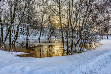 The flood of the Korchminsky stream in the middle of winter in the village of Sapernoye.