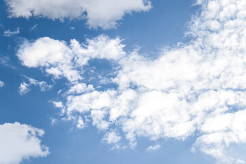 white fluffy clouds in the blue sky