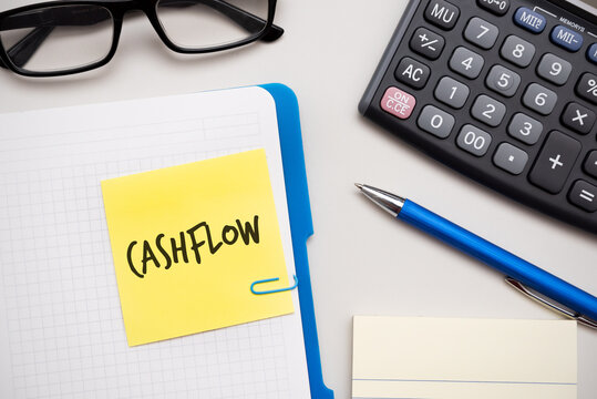 Cashflow word on sticky note. Finance, budget
