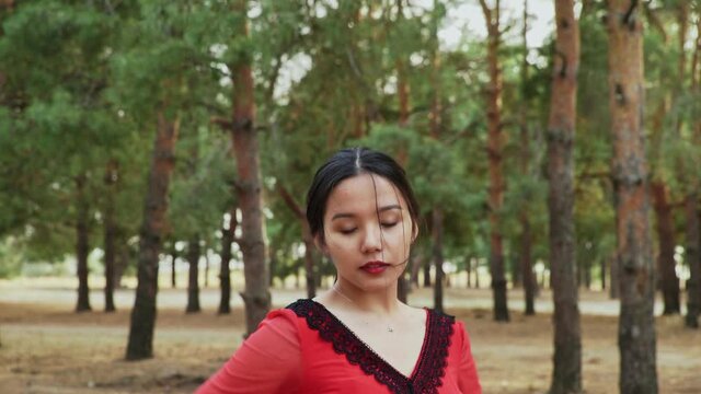 Young asian woman are dancing Traditional Spanish dance in summer forest