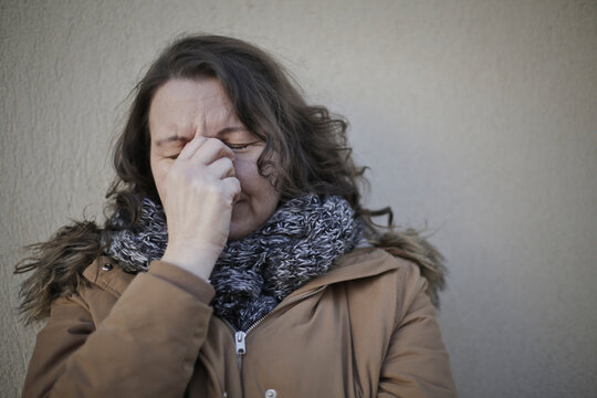 
portrait of donan ceh crying leaning against a wall