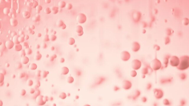 Super Slow Motion Shot of Dripping Pink Droplets at 1000 fps.