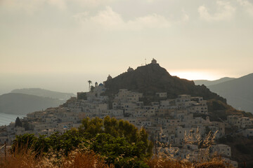 View at Ios main village or Chora at sunset time from a viewpoint in the mountain above, Ios...